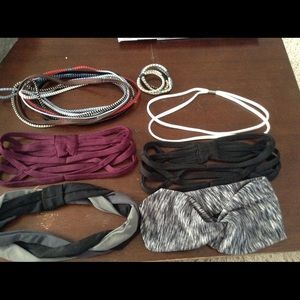 Lot of workout headbands and hair ties